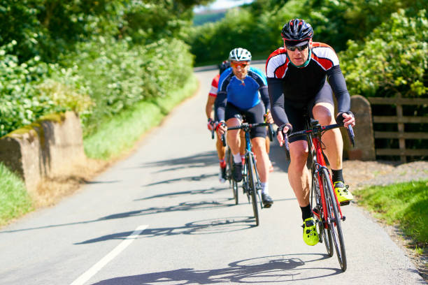 istock Cyclists racing on country roads. 1002108038