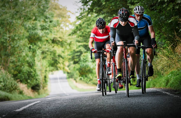 Fitness friends, speed and cycling race in road for triathlon competition, performance or action. Sports team, back of people or riding on bicycle for cardio exercise, endurance challenge or workout