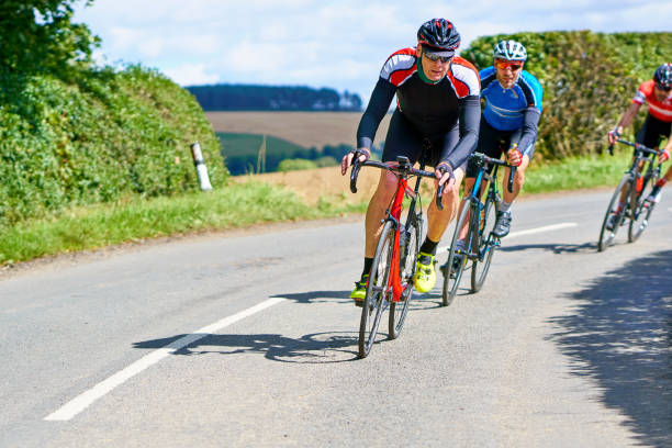 istock Cyclists racing on country roads. 1002108400