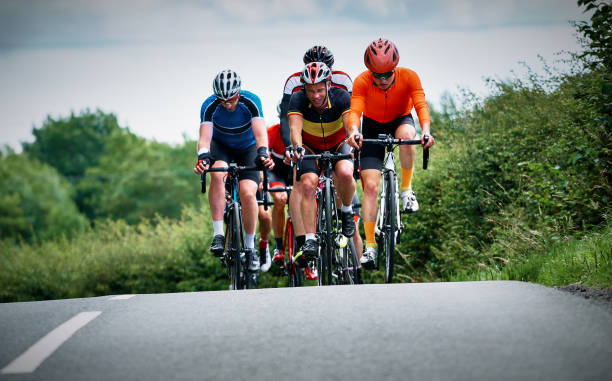 istock Cyclists racing on country roads. 1002108710