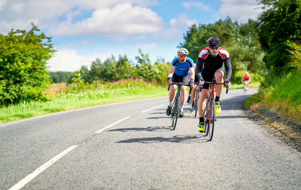 istock Cyclists racing on country roads. 1002108936
