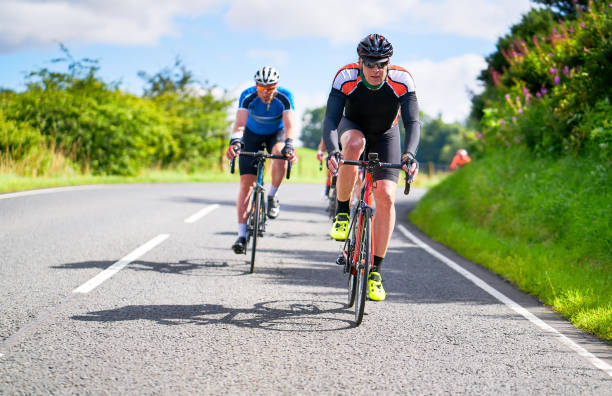 istock Cyclists racing on country roads. 1002109094