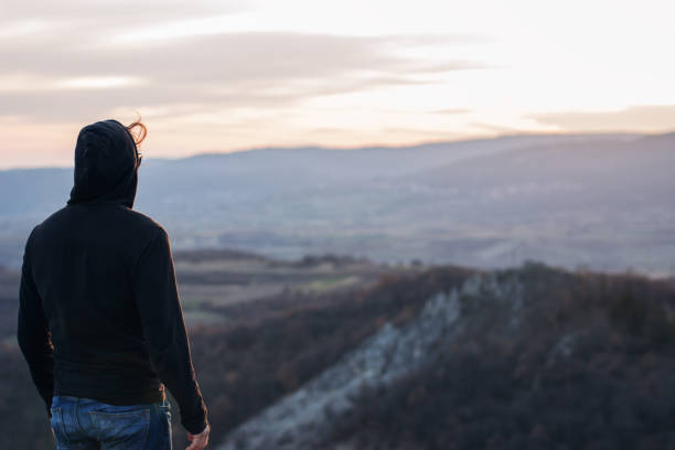 istock Man on top of the mountain 1002112680