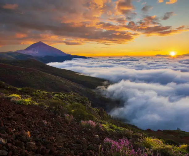Photo of spectacular sunset above the clouds in the Teide volcano national park in Tenerife