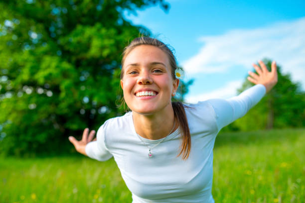 Young Carefree Woman Embracing Nature.