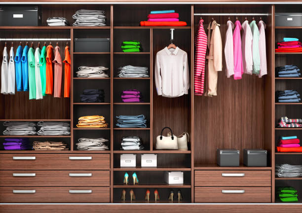 istock Big wardrobe with different clothes for dressing room. 3d illustrations 1002113956
