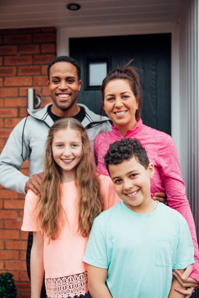 istock Family Portrait in Front Yard 1002117744