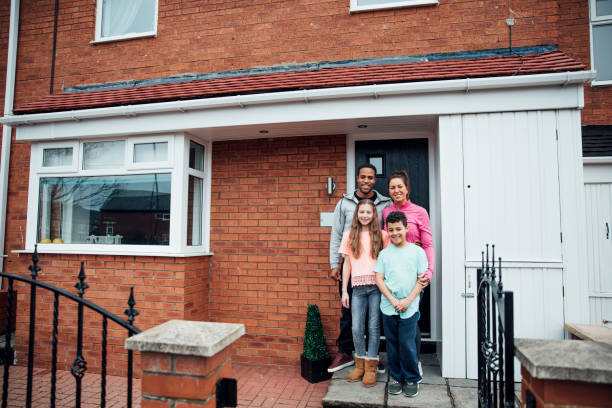 istock Family Portrait in Front Yard 1002117748