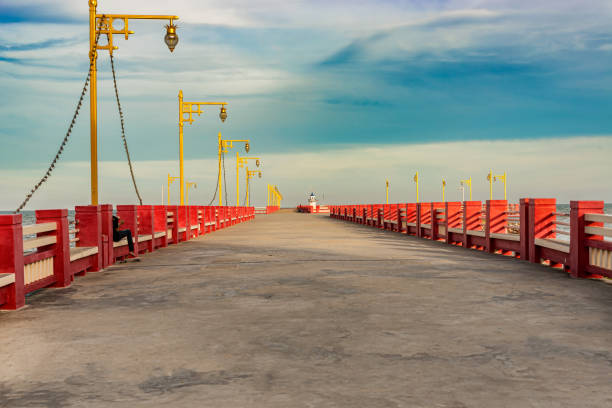 istock Wharf at the seaside in Prachuap Khiri Khan, Thailand. 1002117812