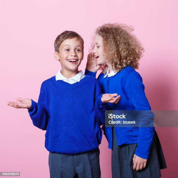 Portrait Of Cute And Happy Schoolboy And Schoolgirl Stock Photo - Download Image Now