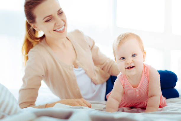 istock Positive delighted woman controlling her child 1002118086