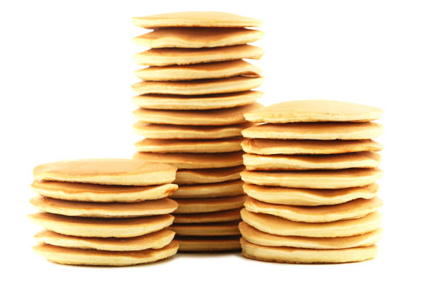 istock Tasty pancakes isolated on white 1002123526