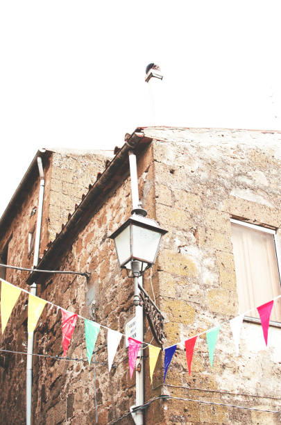 istock Multicolored festive bunting on street 1002135674