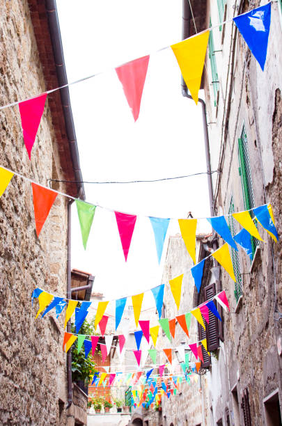 istock Multicolored festive bunting on street 1002135688