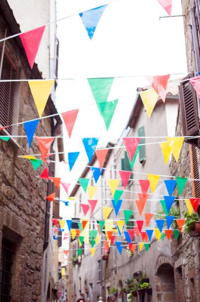 istock Multicolored festive bunting on street 1002135692