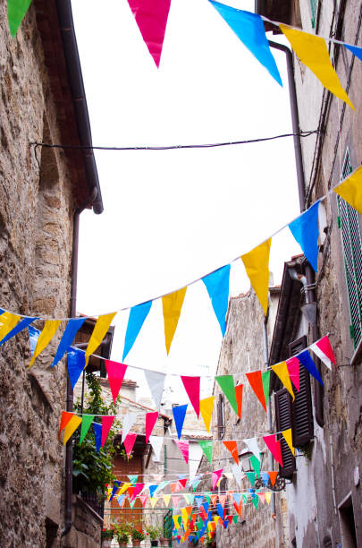 istock Multicolored festive bunting on street 1002135716