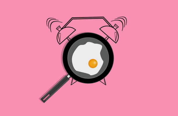 istock Realistic illustration of pan with fried egg and hand drawn alarm clock on pink background. Top view 1002139880