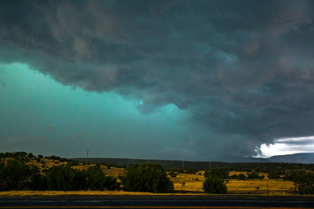 istock Severe thunderstorm with rain and hail shaft looms over rolling hills and highway 1002139998