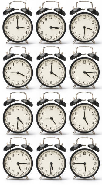 istock Set of alarms showing a different time, isolated on a white background 1002140020