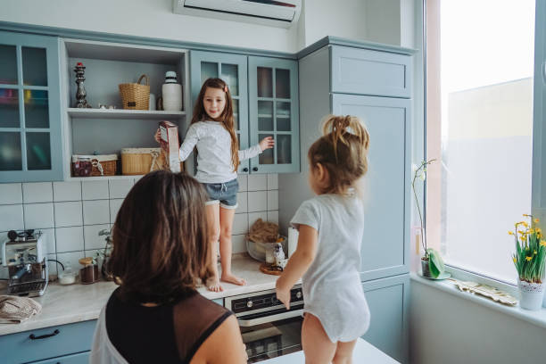 istock Happy family having fun in the kitchen 1002148752