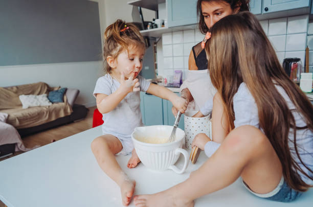 istock Happy family cook together in the kitchen 1002149030