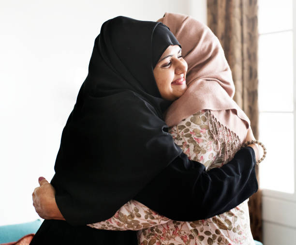 istock Muslim women hugging each other 1002149388
