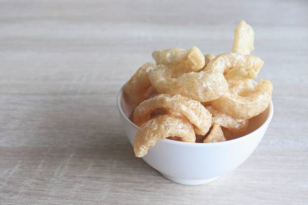 istock Streaky pork with crispy crackling in white bowl on table 1002150408