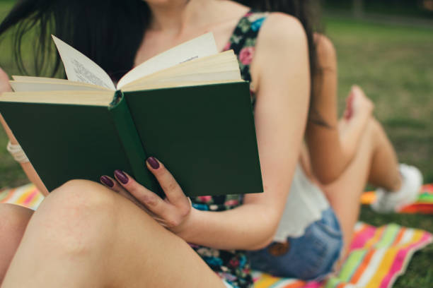 istock Relaxing in nature with book and music 1002152866