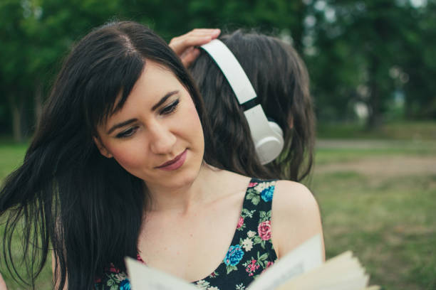 istock Relaxing in nature with book and music 1002152990