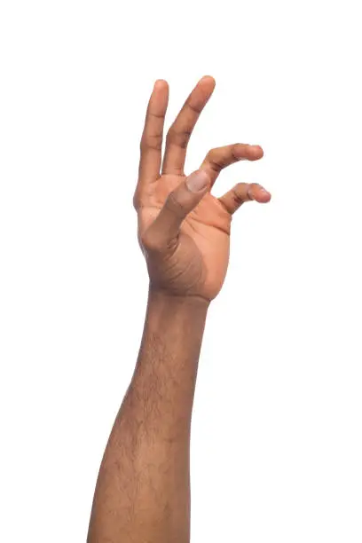 Photo of Hand of black man reaching virtual object, isolated on white
