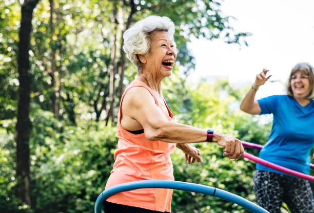 istock Senior woman exercising with a hula hoop 1002157928