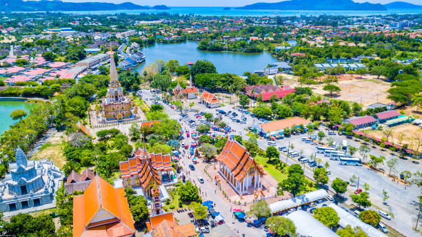 Aerial view  Wat Chalong or formally Wat Chaiyathararam in Phuket, Thailand Aerial view  Wat Chalong or formally Wat Chaiyathararam in Phuket, Thailand phuket province stock pictures, royalty-free photos & images