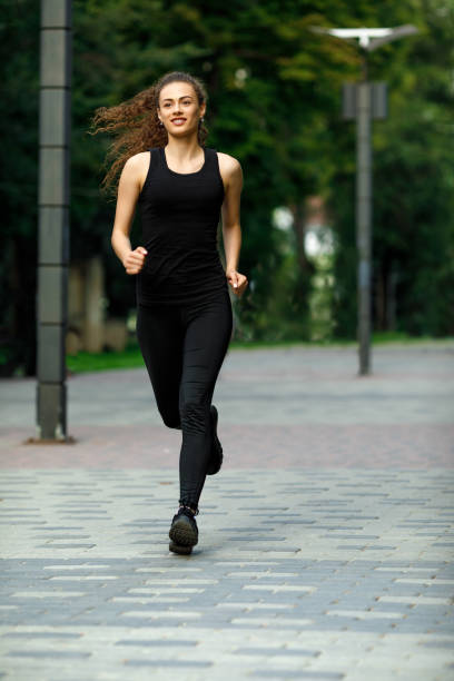 istock young attractive woman running 1002169518