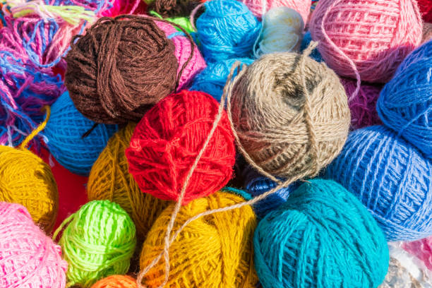 istock Balls of colored yarn under sunlight, close up. 1002174476