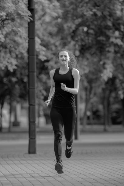 istock young attractive woman running 1002174696