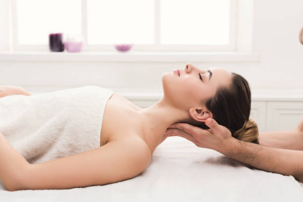 istock Woman getting classical back and neck massage 1002179344