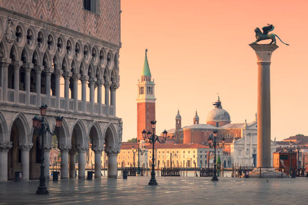 Piazza San Marco in Venice Morning on Piazza San Marco in Venice, next to the Doge's Palace. In the background is the San Giorgio Maggiore church, and on the right the Column of St Marco. san giorgio maggiore stock pictures, royalty-free photos & images