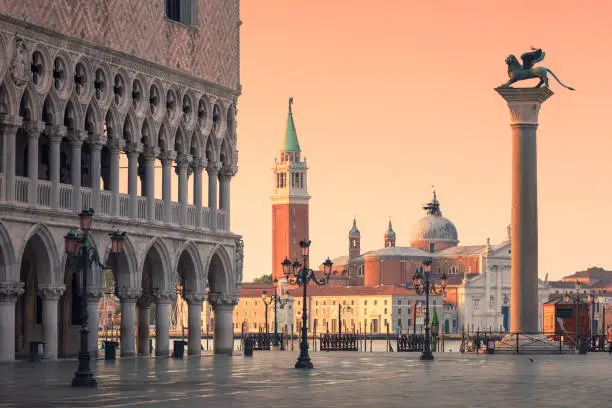 Morning on Piazza San Marco in Venice, next to the Doge's Palace. In the background is the San Giorgio Maggiore church, and on the right the Column of St Marco.