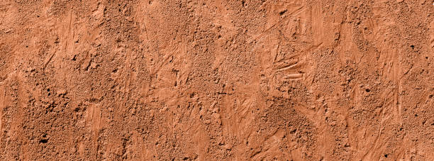 istock orange concrete uneven cracked background 1002191412