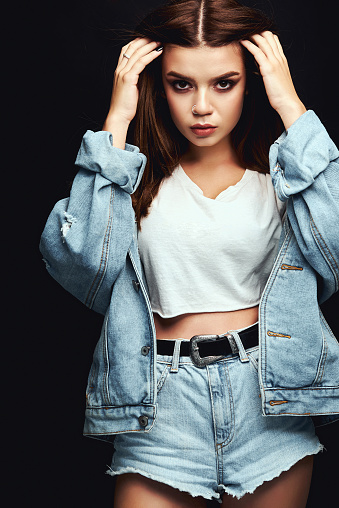 nominelt justering Fil A Girl In A Denim Jacket And Short Shorts Posing In The Studio On A White  Background Stock Photo - Download Image Now - iStock