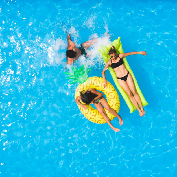 istock Family in the pool 1002194530
