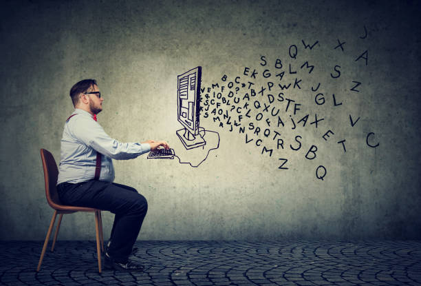istock Young business man working at desk on computer writing an email 1002199870