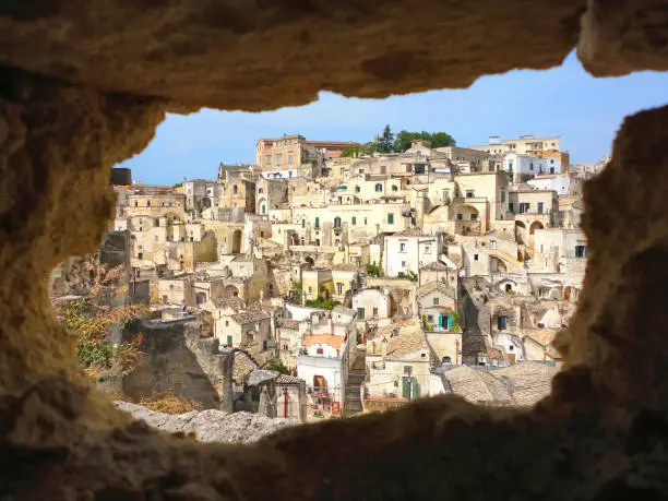 the view on the picturesque houses of the old city of Matera from the cave on the opposite hill, South Italy