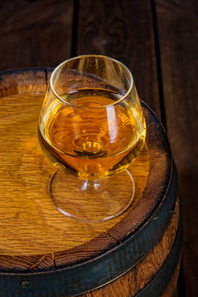 istock delicious bourbon on a wooden barrel 1002212404