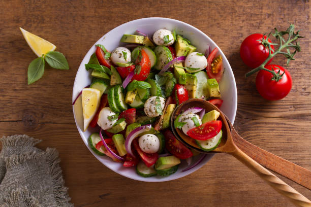 istock Avocado, tomato, cucumber salad with mozzarella cheese 1002212658