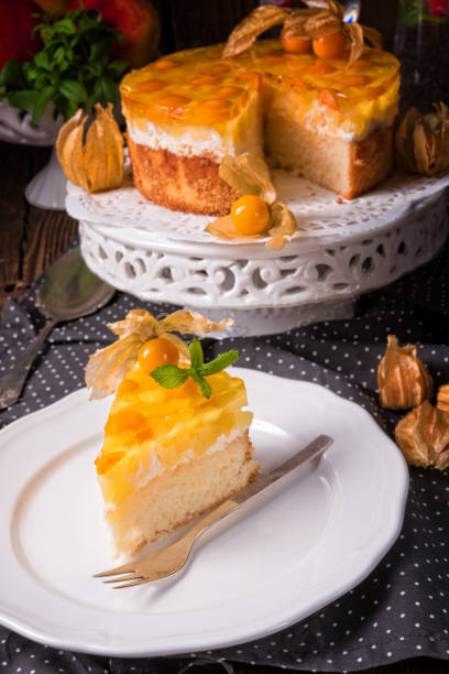 istock delicious cakes with Physalis, fresh apples and cream 1002215876