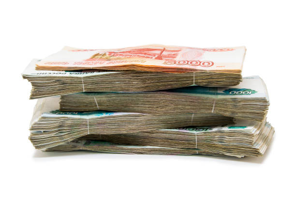 istock Lots of money isolated on white 1002216408