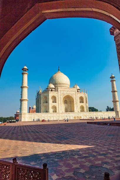 istock Taj Mahal in India under blue sky 1002217378