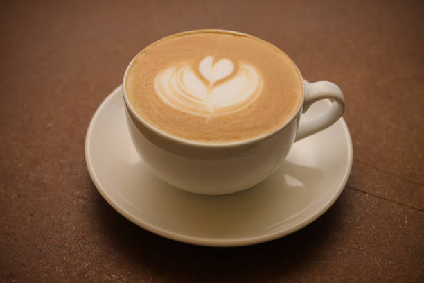 istock Hot coffee cafe latte on wood table 1002217998