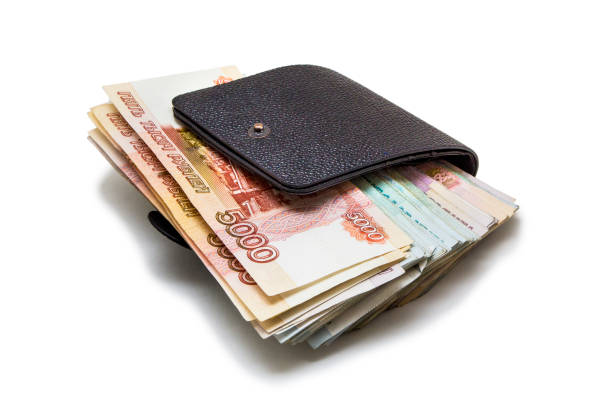 istock Lots of money isolated on white 1002218036